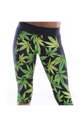 Pantalon de yoga taille haute avec motifs imprimes feuilles vertes noir.